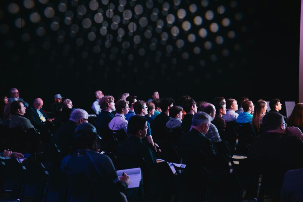 Audience watching a live event presentation, Great British moderators