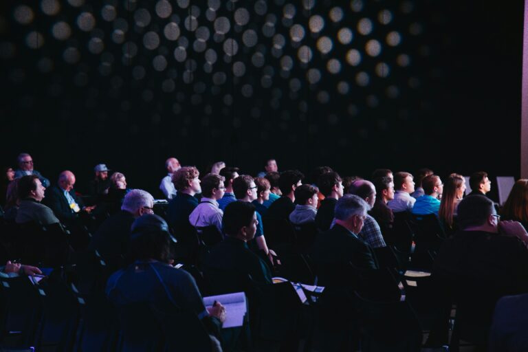 Audience watching a live event presentation, Great British moderators