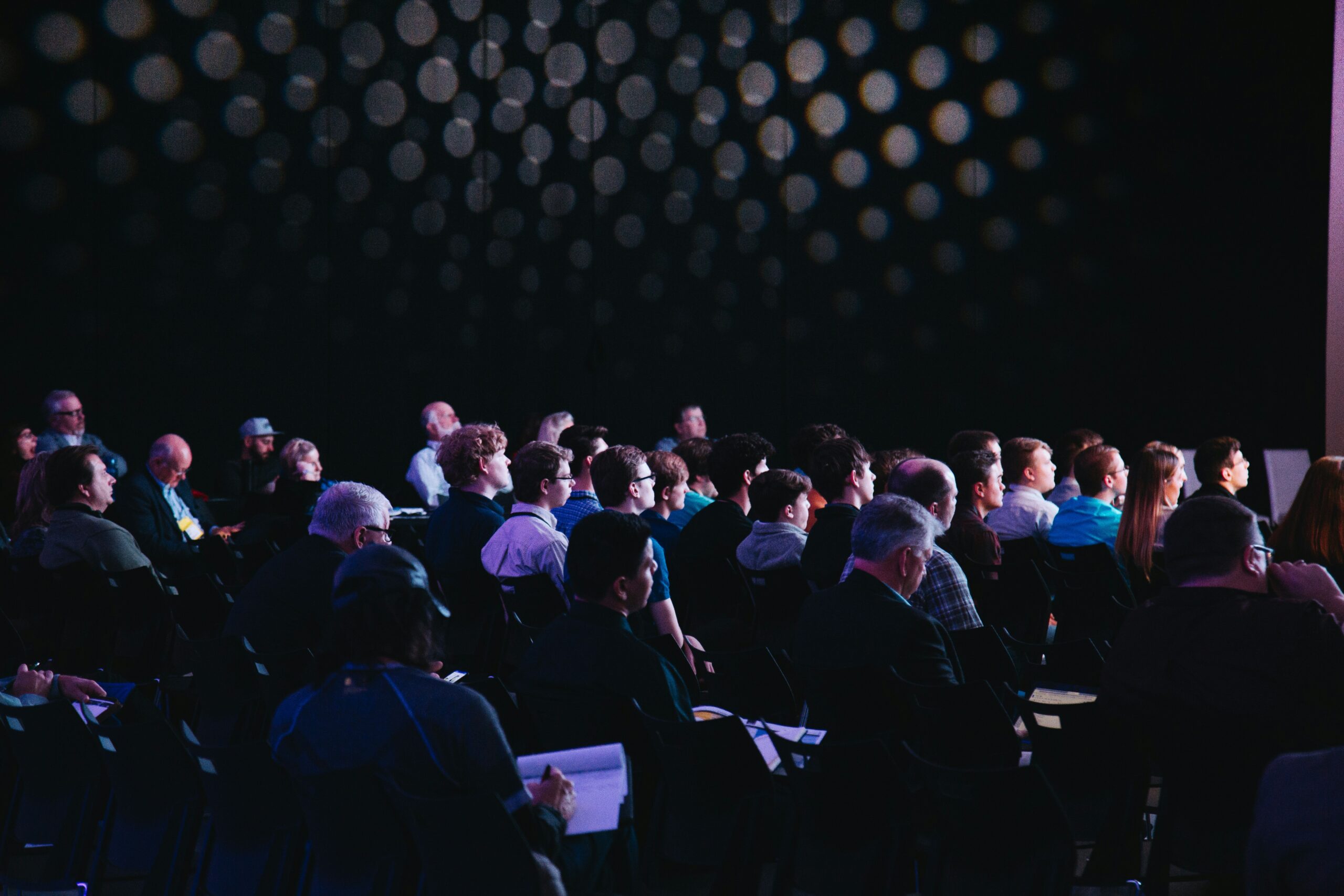 Audience watching a live event presentation, Great British moderators